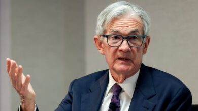Powell sees tariffs raising inflation and says Fed will wait before further rate moves
