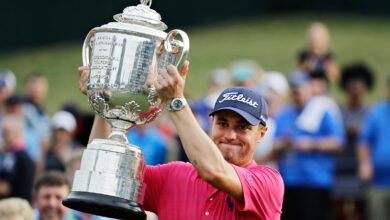 Don’t drop it! The PGA Championship’s 27-pound Wanamaker Trophy can be a beast to hoist