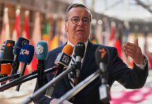 German defense minister says draft could return if volunteer numbers fall short