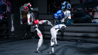 In world’s first humanoid boxing match, gloating robot face plants
