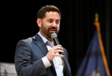GOP congressman is shelled with questions about Trump during raucous town hall