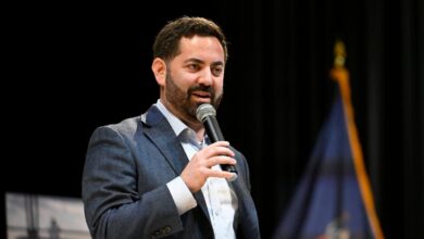 GOP congressman is shelled with questions about Trump during raucous town hall