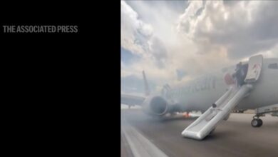 American Airlines evacuation in Denver as fire burns