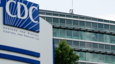 CDC staff reel from shooting, harassment, vaccine panel and mass layoffs