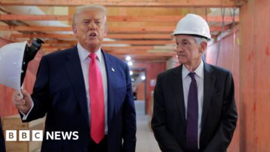 Fed holds interest rates steady despite Trump pressure