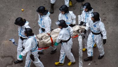 Death toll in Hong Kong apartment complex blaze rises to 146 as the city mourns