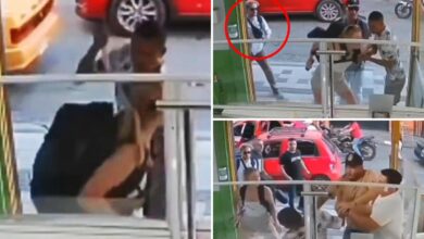 Spineless tourist cowers as young woman fights off armed robber in Colombia, viral video shows