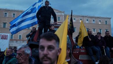 Angry Greek farmers converge on parliament with tractors in overnight protest rally
