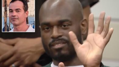 Male prostitute who murdered neurosurgeon smirks, smiles and waves as hit with huge sentence