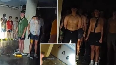 Viral disturbing bodycam footage shows dozens of shirtless, blindfolded University of Iowa pledges covered in food in frat basement