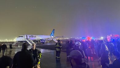 Passengers evacuated via slides in incident that temporarily suspended flights at Newark Airport