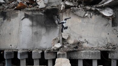 Media may have unmasked Banksy — again. Some fans are angered, dealers aren’t ruffled