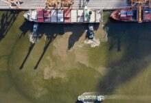 What will it take for ships to start sailing through the Strait of Hormuz again?