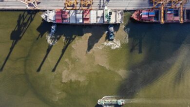 What will it take for ships to start sailing through the Strait of Hormuz again?