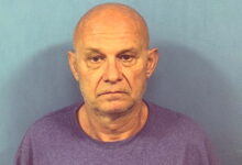 Man faces sixth DUI after being found slumped over wheel at suburban intersection, officials say