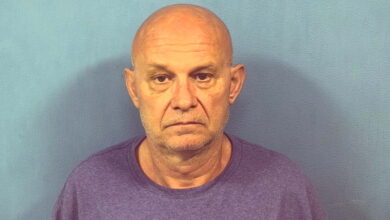 Man faces sixth DUI after being found slumped over wheel at suburban intersection, officials say