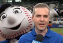 Mr. Met dances behind Steve Gelbs during Carlos Mendoza TV segment