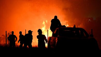 Hundreds of firefighters battle a wildfire in Portugal, while Greek authorities warn of toxic smoke
